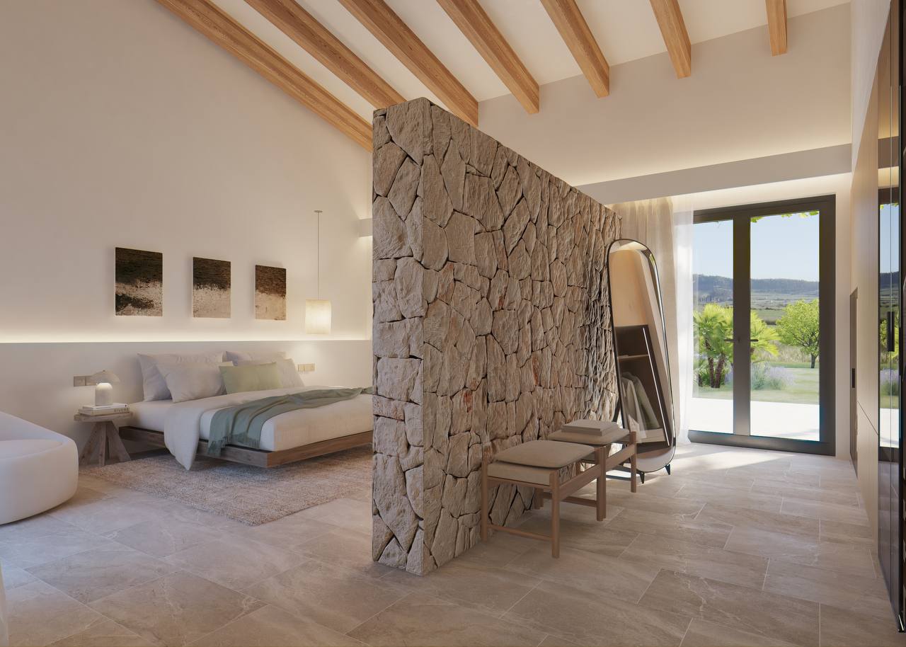 Dormitorio con piedra natural y salida al paisaje